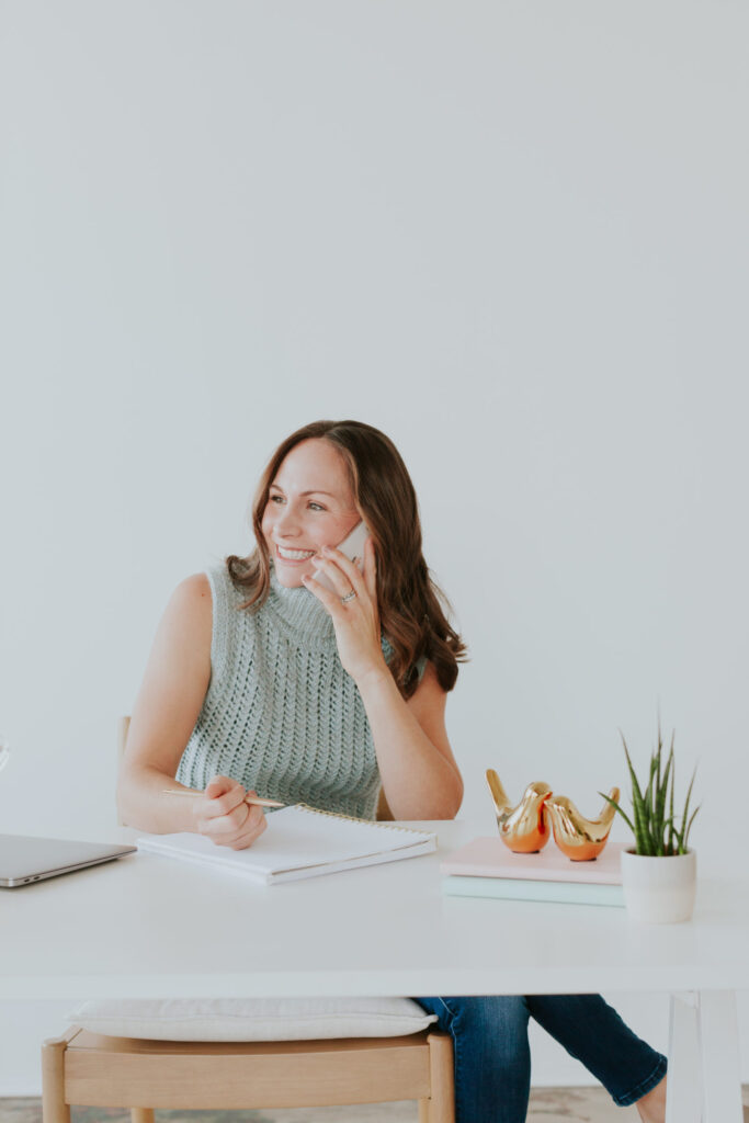 female-business-owner-brand-photo-talking-on-phone-the-frame-charlotte