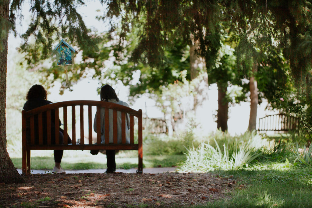 women-sitting-on-bench-chautauqua-grounds-boulder-co