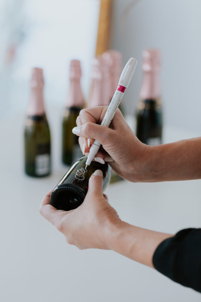 Calligrapher writing on small bottle