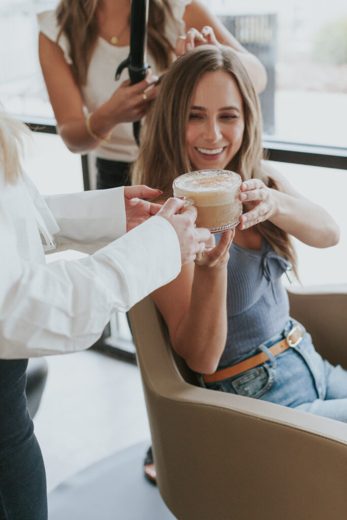 brand-photo-client-receiving-coffee-during-hair-styling-appointment-at-south-charlotte-salon